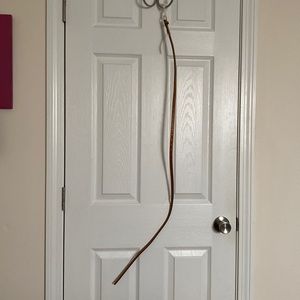 Thin, Carmel-brown colored belt. Never worn.